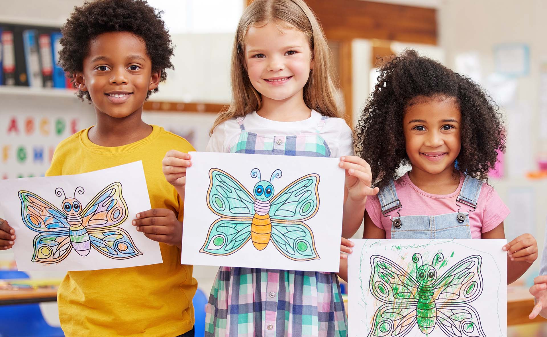 shot-of-a-three-preschool-students-showing-off-the-2022-11-23-20-36-37-utc